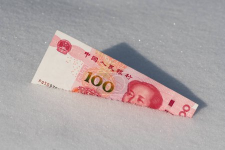 100 Chinese Yuan banknote in the snow