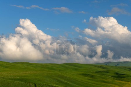 Picturesque clouds over a high mountain plateau on a spring evening