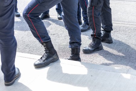 Typical shoes of italian carabinieri police officers. Leather shoes on feet of police unit in italy.. Police shoewear