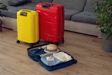 Foto de Travel concept . suitcases at home living room. Holiday vacation traveling abroad concept - Imagen libre de derechos