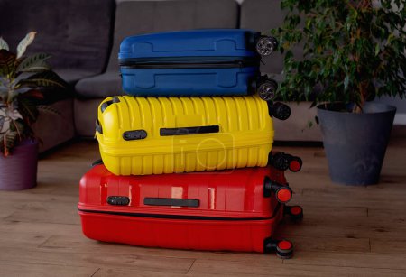 Foto de Packed suitcases with belongings on bed. Travel concept - Imagen libre de derechos