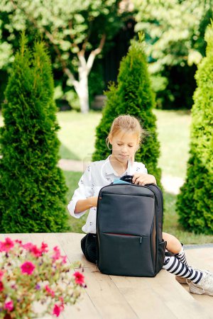 Photo for Happy kid in going to school for the first time. Child girl with bag go to elementary school. Child of primary school. Pupil go study with backpack. Back to school - Royalty Free Image