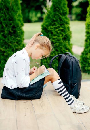 Photo for Back to school. Girl with backpack outdoors. Beginning of lessons. First day of fall. - Royalty Free Image