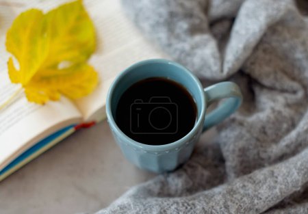 Photo for Top view of cozy blanket, open book and hot cup of coffee on a cold autumn day. Relaxation and hygge concept. Top view with copy space - Royalty Free Image