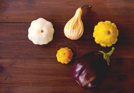 Photo for Healthy food from vegetables. Autumn harvest of pumpkins on wooden board. copy space - Royalty Free Image