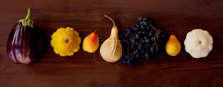 Photo for Healthy food from vegetables. Autumn harvest of pumpkins on wooden board Banner,copy space - Royalty Free Image