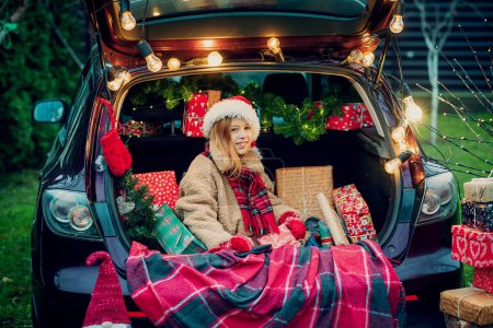 Photo for Merry Christmas. girl with Christmas gifts outdoors - Royalty Free Image