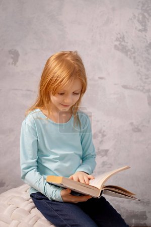 Photo for Digital detox and leisure concept . girl reading book at home - Royalty Free Image