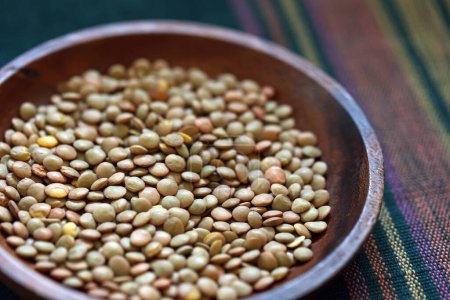 Lentils served on a round wooden plate