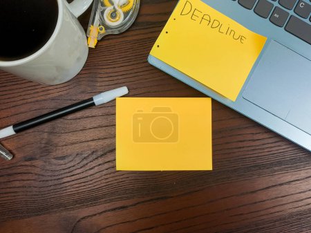 Photo for Flat lay, mock up yellow notes. workspace in the background of the office desk from the top view. A workspace with yellow notes, laptops, office supplies, pencils, and coffee cups in the background of a wooden table. - Royalty Free Image