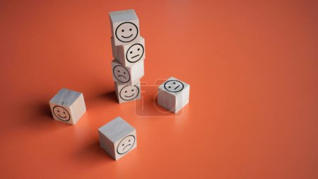 Photo for Wooden cubes with neutral, happy and sad icon. Copy space for text. Good feedback rating and positive customer review, satisfaction survey, mental health, world mental health day concept - Royalty Free Image