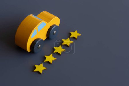 Photo for Toy car and five stars rating. Copy space for text. Transportation and service concept. - Royalty Free Image