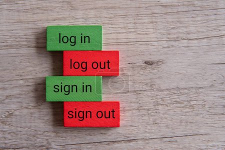 Top view image of wooden blocks with text LOG IN, LOG OUT, SIGN IN, SIGN OUT. 