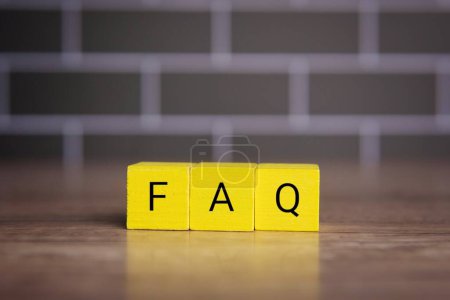 Photo for Wooden cubes with alphabet FAQ. Frequently asked questions concept. - Royalty Free Image