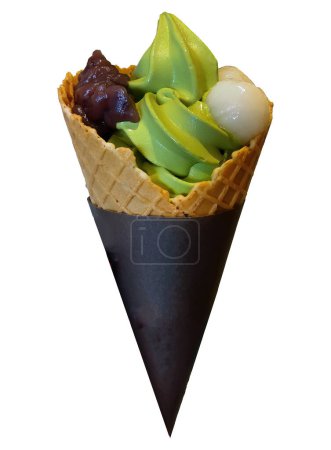 Photo for Isolated premium green tea flavor ice cream, soft serve cone, cold dessert decorated with sweet red beans paste and rice dough dumplings Japanese style, white background with clipping path - Royalty Free Image