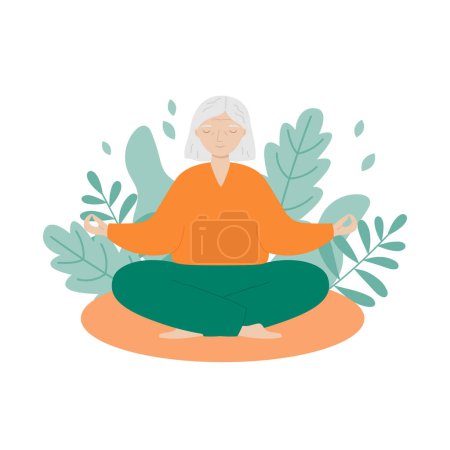 La mujer mayor se sienta con las piernas cruzadas y medita. La anciana hace yoga matutino o ejercicios de respiración. 