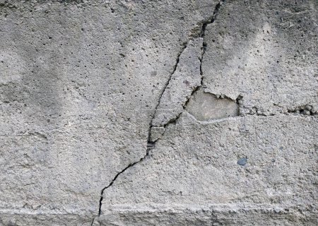 Photo for Large deep crack in concrete. Strong destruction of the concrete wall - Royalty Free Image