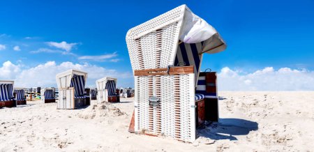 Beach chairs on a sunny day on the beach of Sankt Peter Ording, Germany