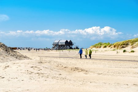 People hiking to the beach in Sankt Peter Ording, North Sea, Germany