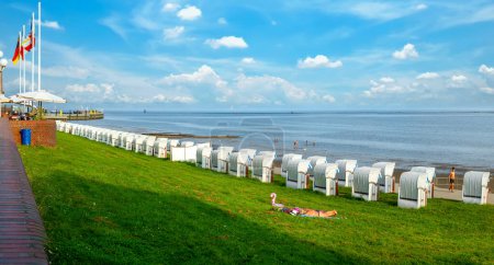 Photo for Beach with beach chairs and dike at the south beach in Wilhelmshaven, Germany - Royalty Free Image