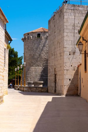 View to the round tower of Frankopan Castle in the old twon of Krk, Croatia