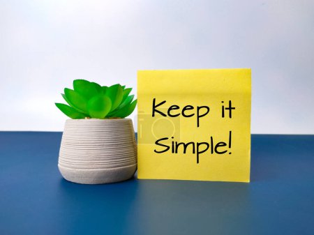 Photo for Green plant and sticky note with the word Keep it simple. Business concept. - Royalty Free Image