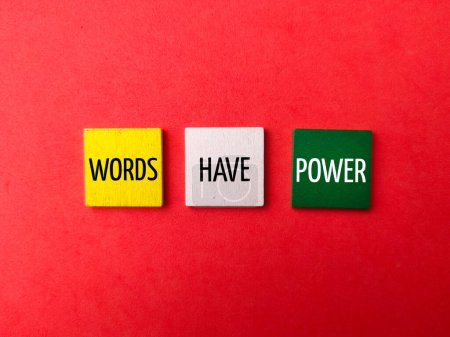 Photo for Colored wooden cube with the word WORDS HAVE POWER on red background. - Royalty Free Image