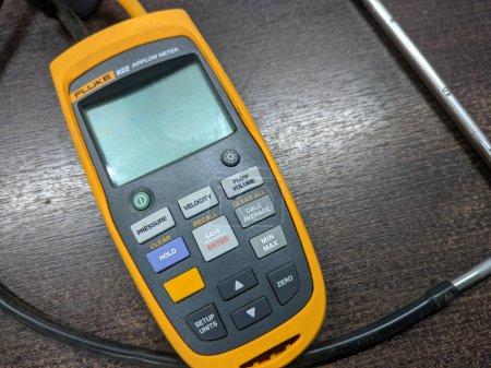 Malaysia,6 June 2022: Fluke 922 Airflow Micromanometer with Bright Backlit Display on a table.