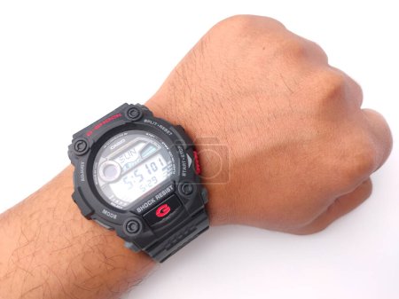 Photo for Malaysia,30 May 2022: Casio Men's G7900-1 G-Shock on a someone hand isolated on white background - Royalty Free Image