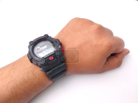 Photo for Malaysia,30 May 2022: Casio Men's G7900-1 G-Shock on a someone hand isolated on white background - Royalty Free Image