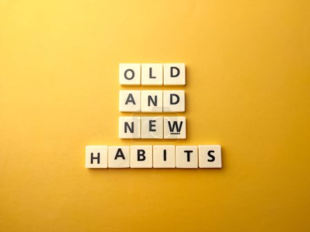 Photo for Top view toys letters with the word OLD AND NEW HABITS on a yellow background. - Royalty Free Image