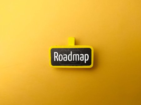 Photo for Top view colored wooden board with text Roadmap on yellow background. - Royalty Free Image