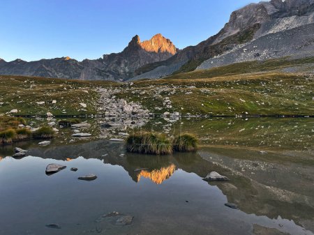 Sunrise Symphony: Peaks Panorama Lake in Vanoise National Park, Hautes Alps, France
