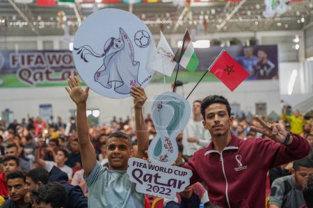 Photo for Palestinians support Moroccan soccer team during its match against the Croatia in FIFA World Cup in Qatar. November 23, 2022, Gaza, Palestine: Hundreds of Palestinians in the Gaza Strip were in the Saad Sail Hall in Gaza Strip - Royalty Free Image