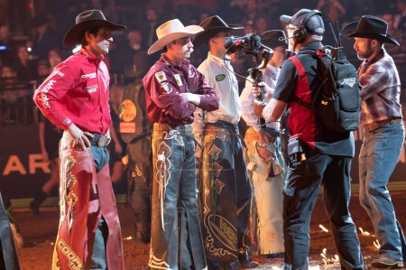Téléchargez les photos : 2023 Professional Bull Riders Unleash The Beast At The Garden. January 08, 2023, New York, New York, USA: Silvano Alves (L) and other bull riders on the field during the opening ceremony for the third round of the Professional Bull Riders 2023 - en image libre de droit