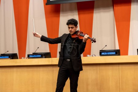 Photo for International Mock Trial on Human Rights. January 31, 2023, New York, New York, USA: Brian Urra plays the violin at a special event International Mock Trial on Human Rights - Royalty Free Image