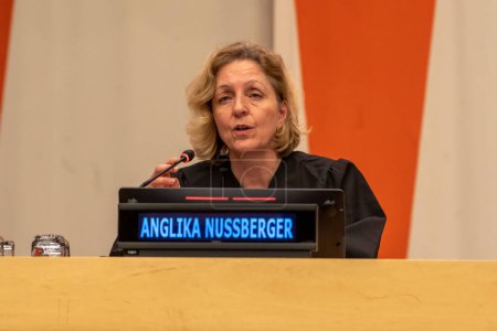Photo for International Mock Trial on Human Rights. January 31, 2023, New York, New York, USA: Honorable Judge Angelica Nussberger, Former Vice President of the European Court of Human Rights, hands down the verdict at a special event - Royalty Free Image