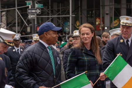 Photo for St. Patrick's Day Parade in New York City. March 17, 2023, New York, New York, USA: New York City Mayor Eric Adams and New York City Fire Department Commissioner Laura Kavanagh march in the St. Patrick's Day Parade along 5th Avenue - Royalty Free Image
