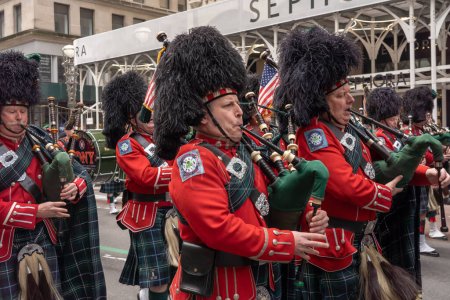 Photo for St. Patrick's Day Parade in New York City. March 17, 2023, New York, New York, USA: Members of the New York City Fire Department Emerald Society Pipes Drums march in the St. Patrick's Day Parade along 5th Avenue on March 17, 2023 - Royalty Free Image