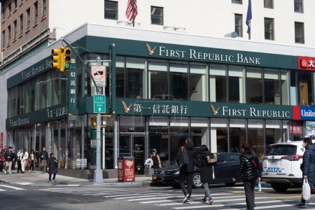 Photo for First Republic Bank. March 18, 2023, New York, New York, USA: People walk past a First Republic Bank branch in Chinatown Manhattan on March 18, 2023 in New York City.   First Republic shares tank on Friday almost 33% despite $30 billion support - Royalty Free Image