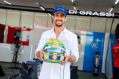 Photo for Formula E Race in Sao Paulo. March 24, 2023, Sao Paulo, Brazil: Lucas di Grassi presents his helmet in the pits in honor of Ayrton Senna before the Formula E free training, at the Anhembi Complex, in the north of Sao Paulo, on Friday (24.) - Royalty Free Image