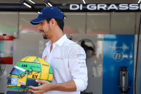Photo for Formula E Race in Sao Paulo. March 24, 2023, Sao Paulo, Brazil: Lucas di Grassi presents his helmet in the pits in honor of Ayrton Senna before the Formula E free training, at the Anhembi Complex, in the north of Sao Paulo, on Friday (24.) - Royalty Free Image