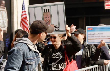 Photo for Donald Trump leaves Trump Tower for Manhattan Criminal Courthouse in New York. April 04, 2023, New York, USA: Heavy movement of press corps and protesters at Trump Tower as the former US President, Donald J. Trump - Royalty Free Image