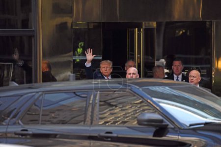 Photo for Donald Trump leaves Trump Tower for Manhattan Criminal Courthouse in New York. April 04, 2023, New York, USA: Heavy movement of press corps and protesters at Trump Tower as the former US President, Donald J. Trump - Royalty Free Image