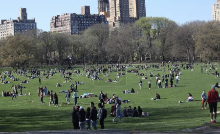 Photo for Easter Holiday Celebrated at Central Park.April 09, 2023, New York, USA: New Yorkers and Tourists are seen celebrating the Easter holiday at Central Park on Sunday (09). The park is crowded with people having picnics, playing sports - Royalty Free Image