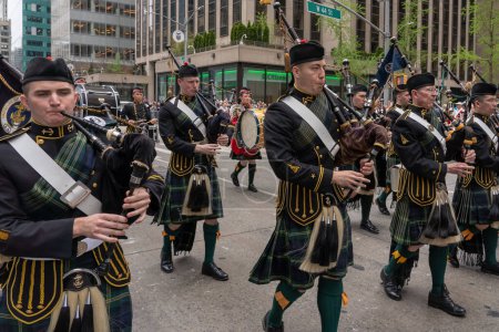 Photo for 25th Annual New York City Tartan Day Parade. April 15, 2023, New York, New York, USA: United States Naval Academy (Annapolis, Maryland) Brigade of Midshipmen bagpipe players march during the 25th Annual Tartan Day Parade in Manhattan - Royalty Free Image