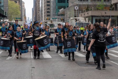 Photo for 25th Annual New York City Tartan Day Parade. April 15, 2023, New York, New York, USA: Pulse of the Place drum line (Edinburgh, Scotland) members march during the 25th Annual Tartan Day Parade in Manhattan on April 15, 2023 in New York City. - Royalty Free Image