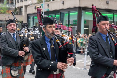 Photo for 25th Annual New York City Tartan Day Parade. April 15, 2023, New York, New York, USA: The New York Caledonian Club bagpipe players march at the 25th Annual Tartan Day Parade in Manhattan on April 15, 2023 in New York City. - Royalty Free Image