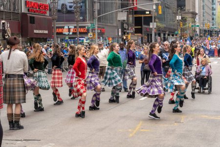 Photo for 25th Annual New York City Tartan Day Parade. April 15, 2023, New York, New York, USA: Dancers from Shot of Scotch New York Scottish Highland dancers group perform at the 25th Annual Tartan Day Parade in Manhattan on April 15, 2023 in New York - Royalty Free Image