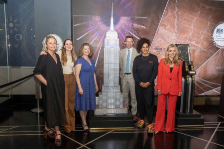 Photo for His Majesty's Consul General of New York Emma Wade-Smith Lights the Empire State Building in Celebration of the Coronation. May 05, 2023, New York, New York, USA: (L-R) Jess Shadbolt, Hannah Young, His Majesty's Consul General - Royalty Free Image